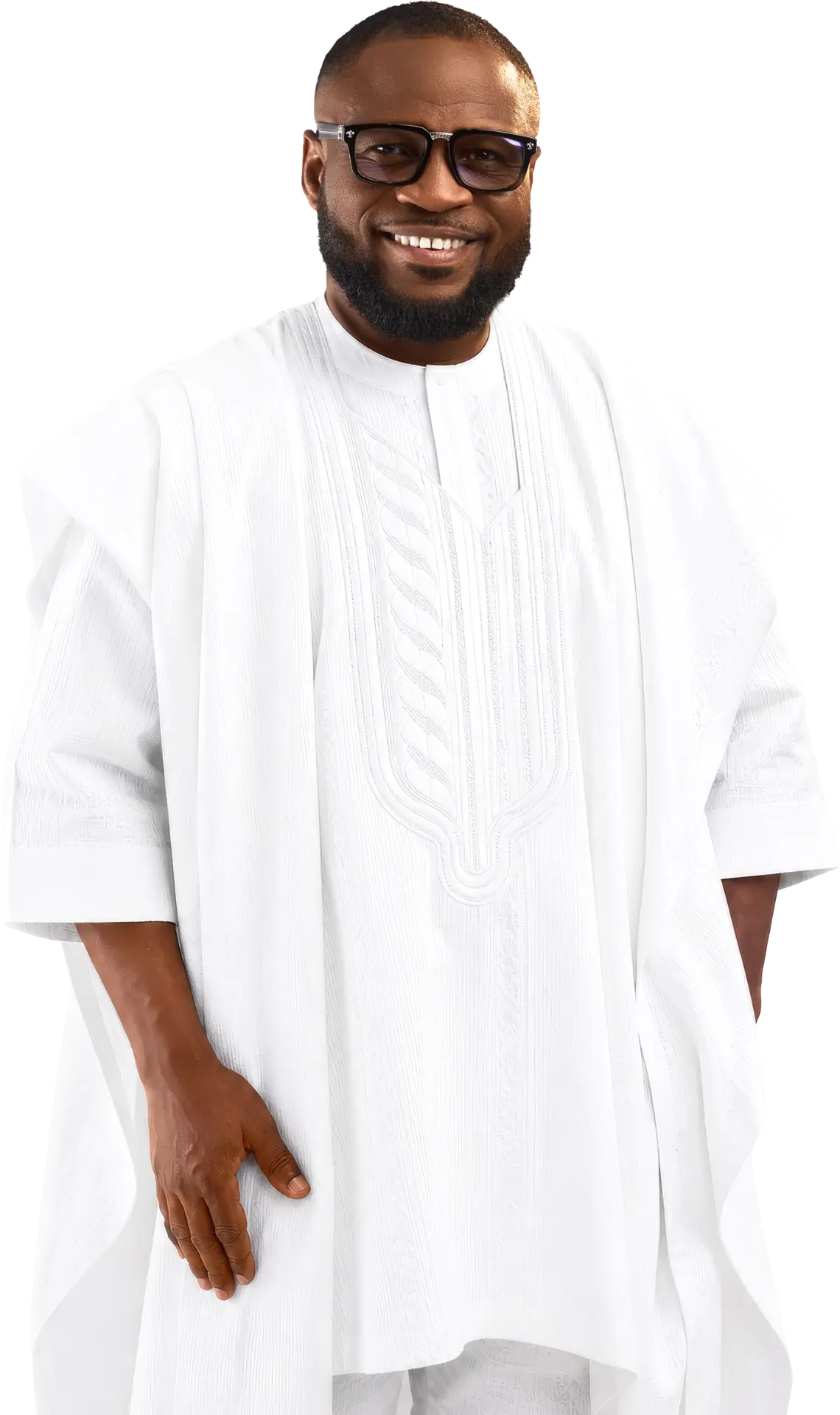 Rev. Edwin Dadson smiling in traditional white attire